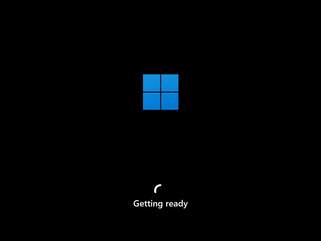 Windows boot screen with the four-square logo and a spinner above the text Getting ready.